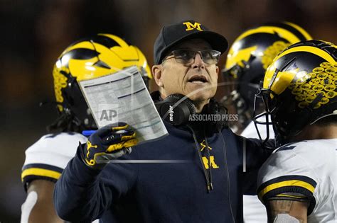 Tickets purchased in the name of suspended Michigan staffer to two SEC title games, AP source says